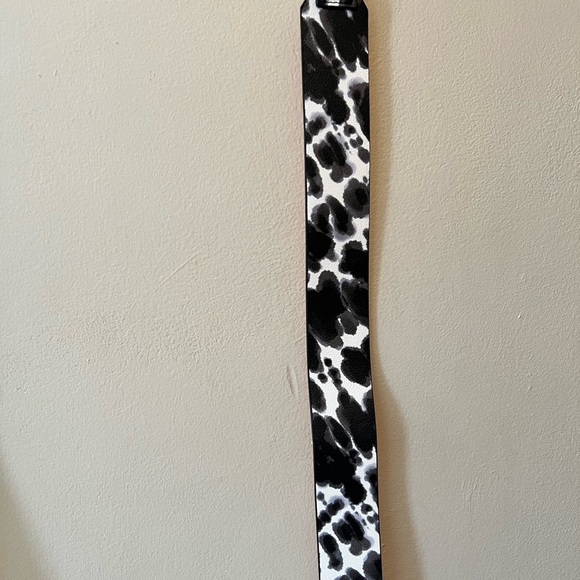 Purse straps. One is 42” long and leopard print, other faux patent leather 32”. - Picture 3 of 8
